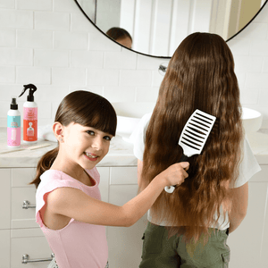 girl brushing her friends hair with no nasties detangler brush