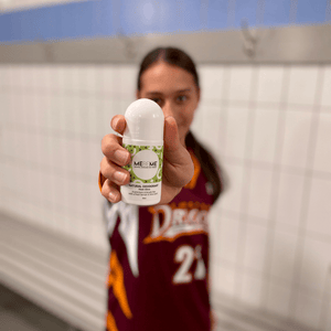 girl in basketball uniform holding natural deodorant by MEBEME