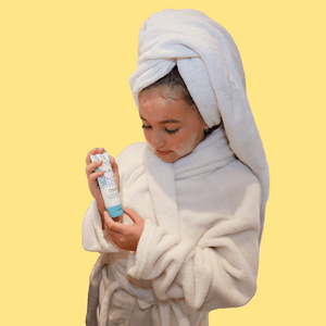 gentle cleanser held by girl