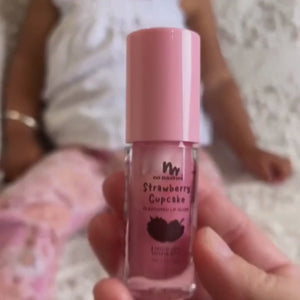 Strawberry Cupcake natural lip gloss handed to little girl