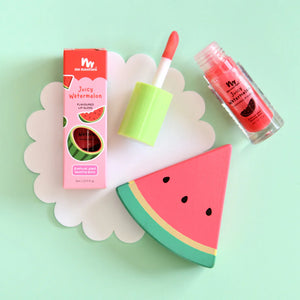 natural watermelon lipgloss on green back ground