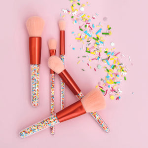 Twinkle Sprinkle makeup brushes for kids on pink background